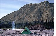 camp site and fire on gravel bar
